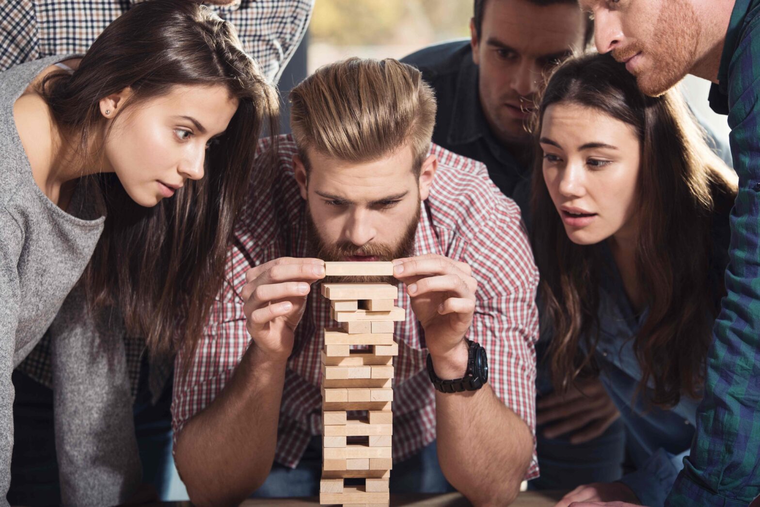 Team of Business People Build a Wooden Construction