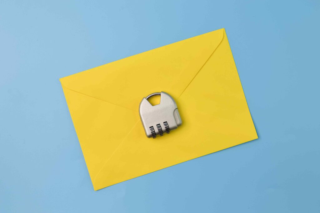 Yellow Envelope and Padlock Isolated on a Blue Bac